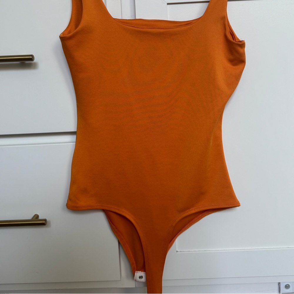 BRAND NEW / NEVER WORN Orange One Piece Body Suit - Picture 7 of 7